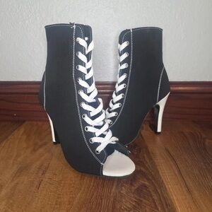 Elegant Black and White Lace-Up Heeled Boots